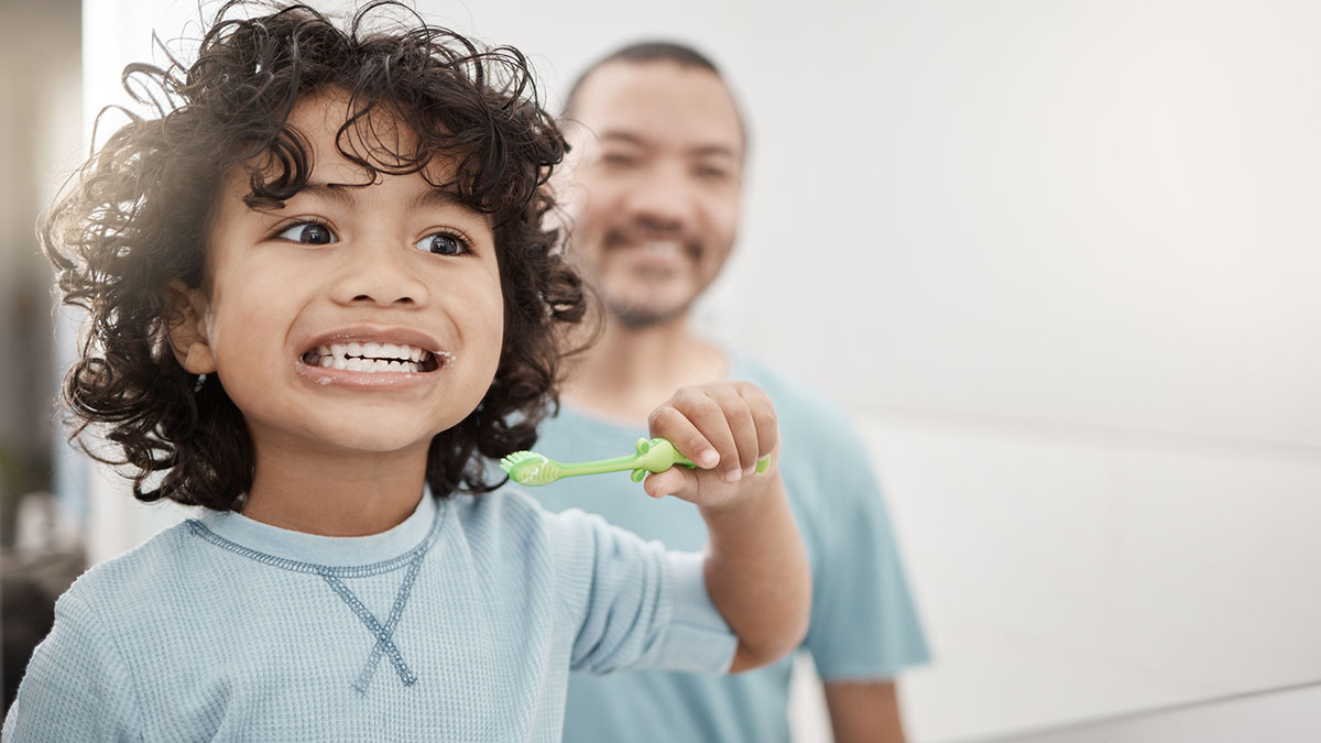 child brushing teeth